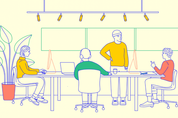 mixkit-four-people-working-together-at-a-shared-desk-in-an-274-desktop-wallpaper-min_optimized